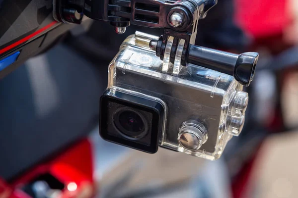 Action camera on a motorcycle rider\'s helmet