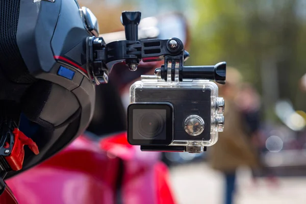 Action camera on a motorcycle rider\'s helmet