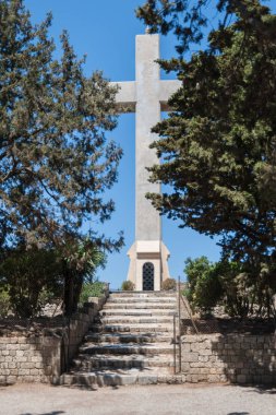 Rhodes Island, Greece. 05/28/2018. The path leading to gigantic cross near Monastery of Filerimos. Christ's passion. Wayside Shrine. Europe.	