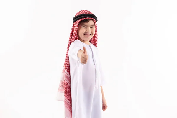 Arab boy in keffiyeh shows thumbs up. — Stock Photo, Image