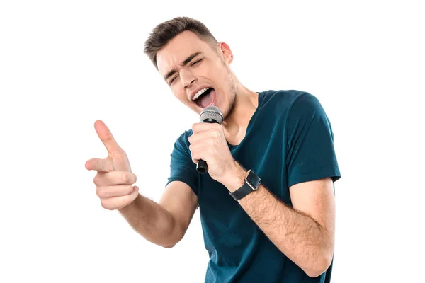 Giovane bel ragazzo che canta karaoke espressivamente — Foto Stock