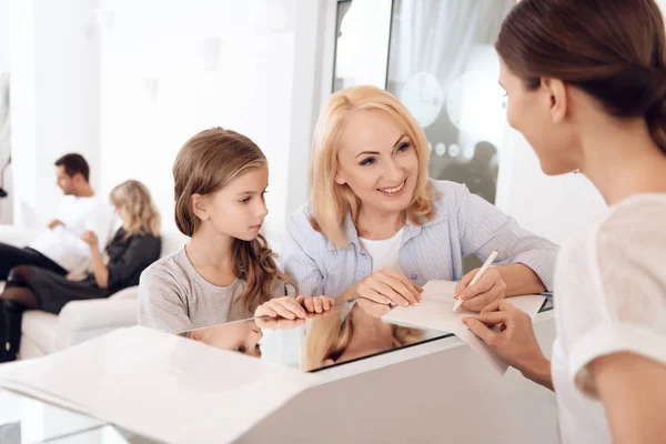 Mature Blonde Woman Fills Documents — Stock Photo, Image