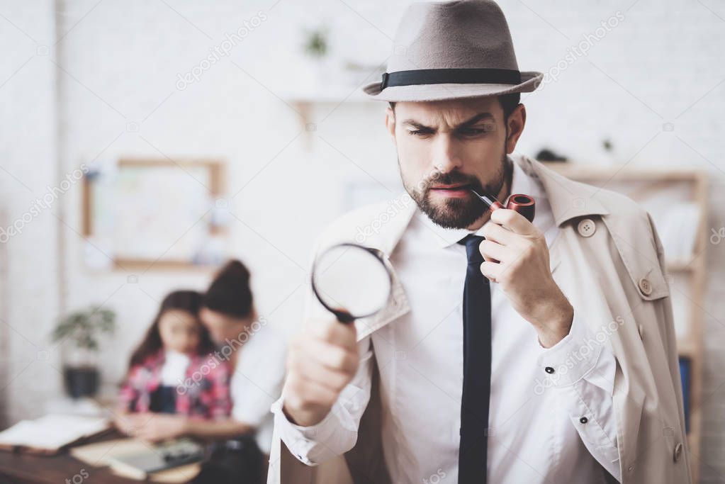 Private detective agency. Man is posing with magnifying glass, woman is holding her daughter.
