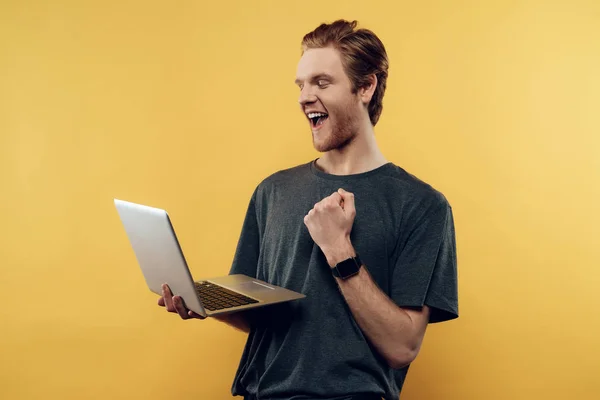 Happy Guy Celebrating Success Using Laptop