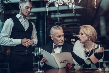 Businessman . Old Business People .Successful Old People. Relax together. Romantic Meeting, Rich People. Resting in Restaurant. Luxury Life. service staff. order to Waiter