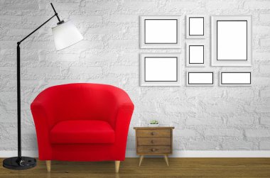 Loft oturma odası ve beyaz duvar önünde kırmızı koltuk.