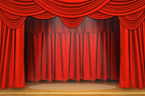 Red curtains and wooden stage floor.