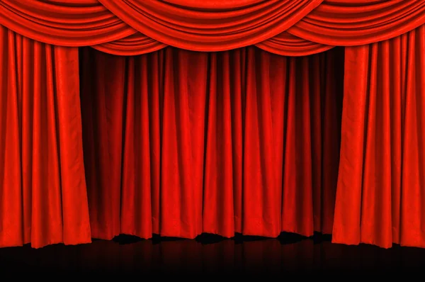 Red curtains and wooden stage floor