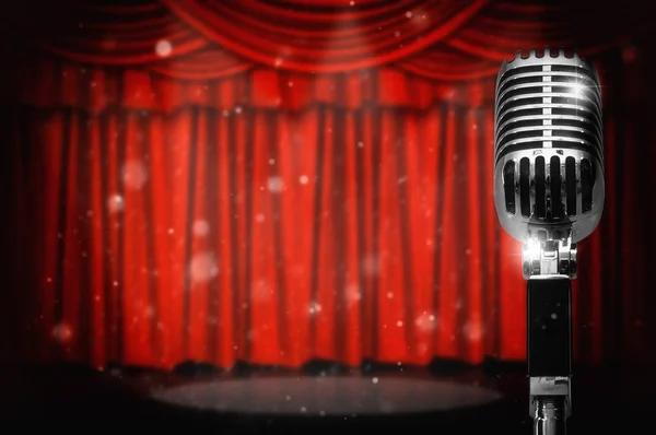 Retro microphone over the red curtain background, vintage musical concept