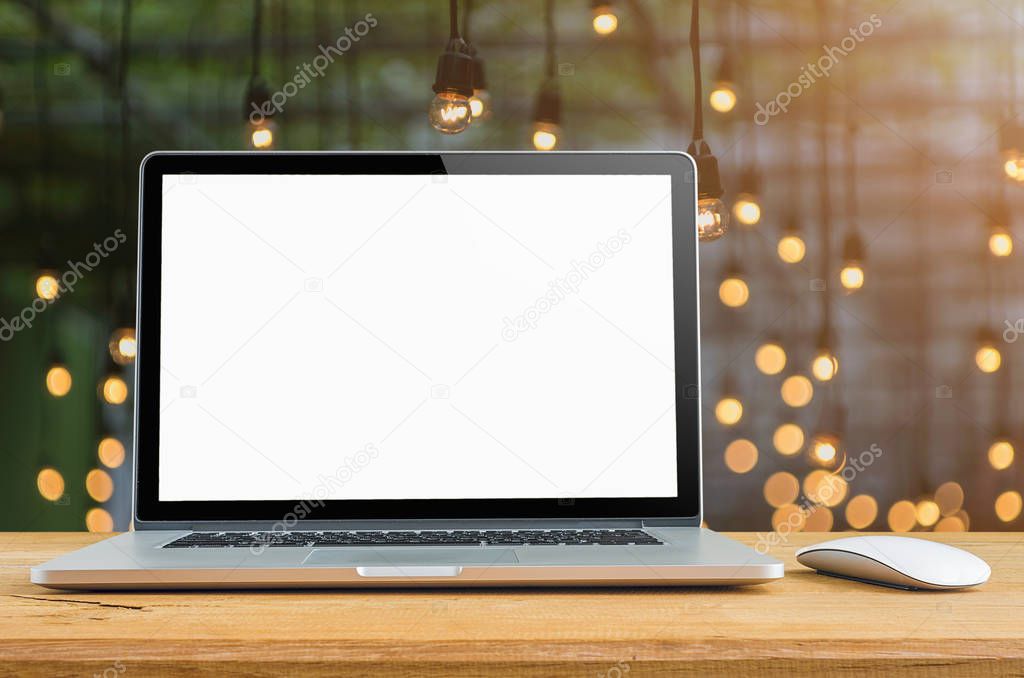 Conceptual workspace, Laptop with blank screen on table.