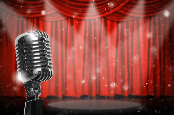 Retro microphone over the red curtain background, vintage musical concept