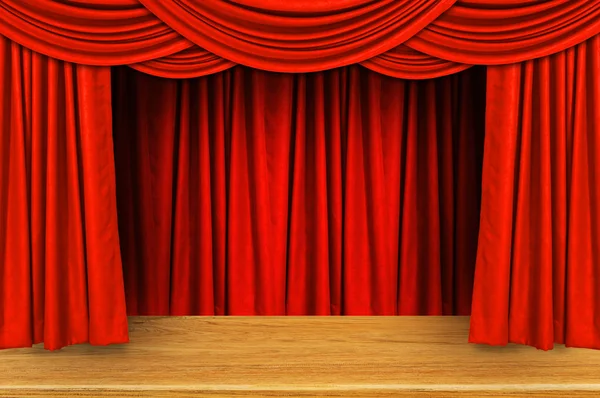 Red curtains and wooden stage floor.