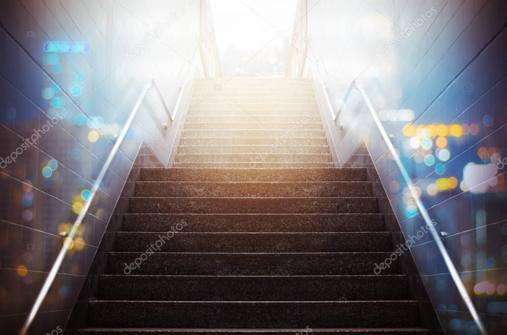 Stairs of subway station with metal railing, Concept into success.