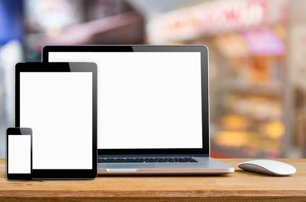 Conceptual workspace, Laptop with blank screen on table.