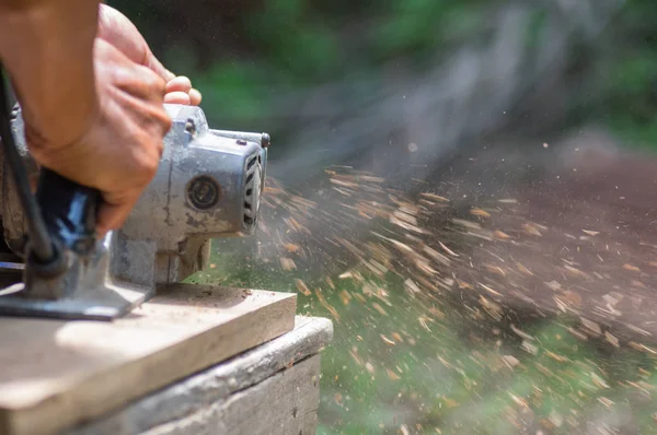 Sanding machine, The carpenter uses a polishing machine to smooth the wood. Soft focus. — Stock Image Sanding Machine Carpenter Uses Polishing Machine Smooth Wood Soft Focus Stock Photo