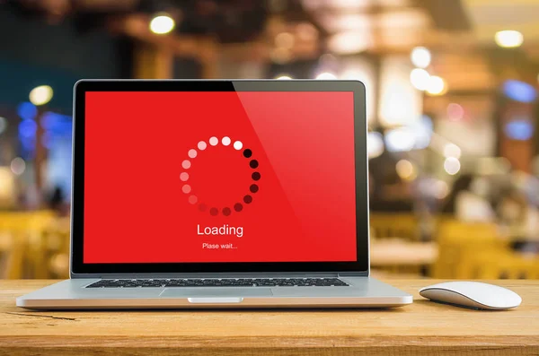 Laptop on table with loading bar load waiting on digital display,  indicator concept.