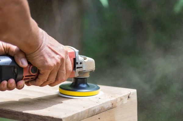 Sanding machine, The carpenter uses a polishing machine to smooth the wood. Soft focus — Stock Image Sanding Machine Carpenter Uses Polishing Machine Smooth Wood Soft Focus Stock Image