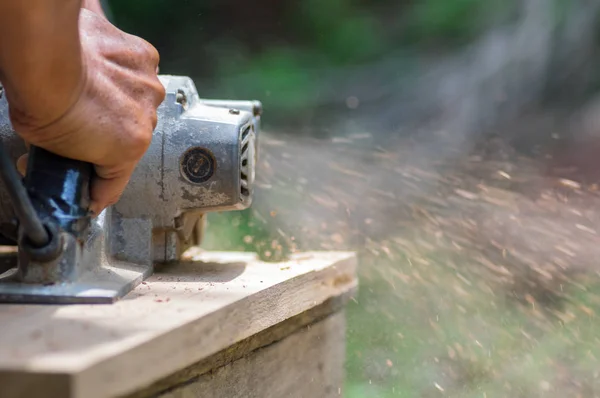 Sanding machine, The carpenter uses a polishing machine to smooth the wood. Soft focus. — Stock Image Sanding Machine Carpenter Uses Polishing Machine Smooth Wood Soft Focus Stock Picture