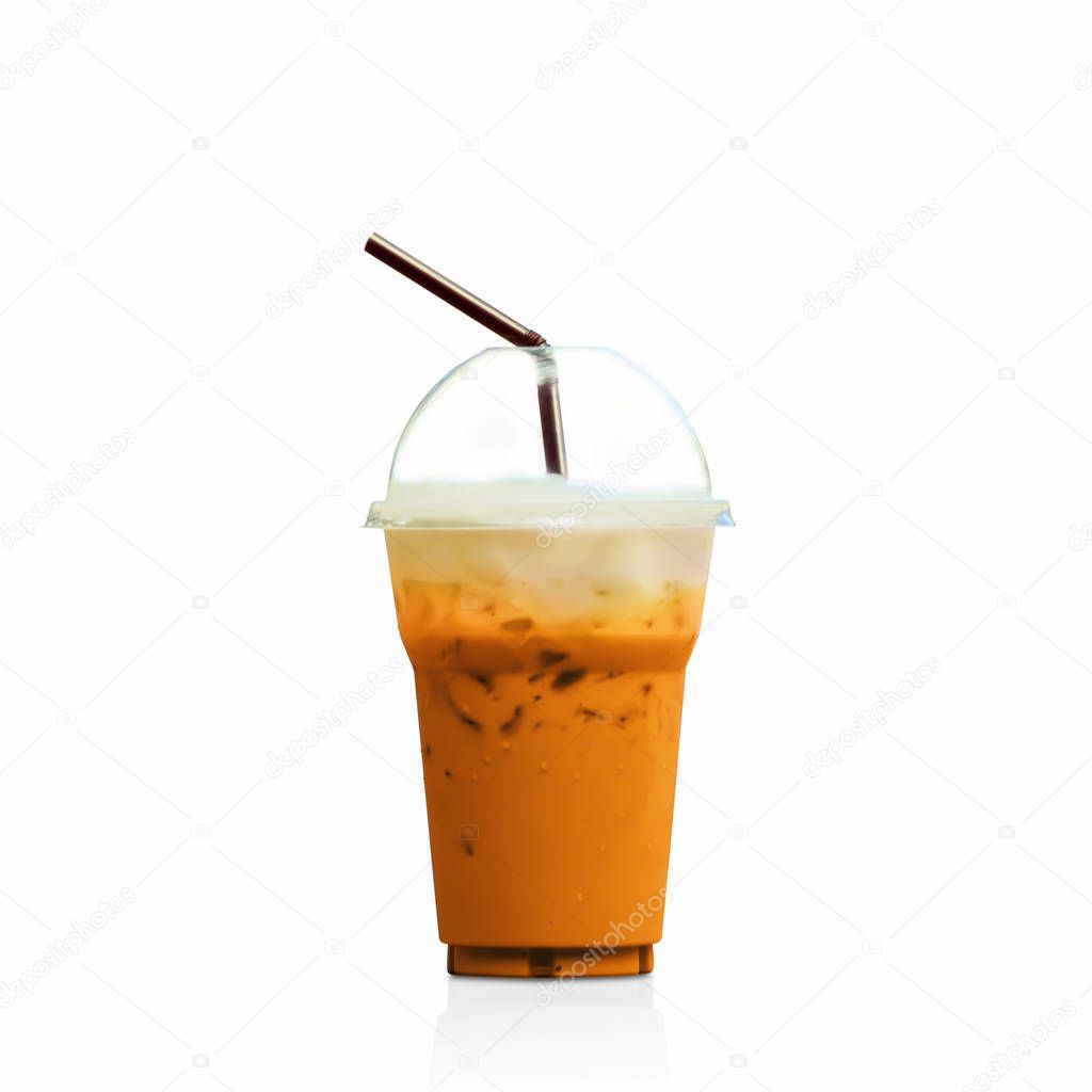 Iced Milk Tea with straw in plastic cup isolated on white background.