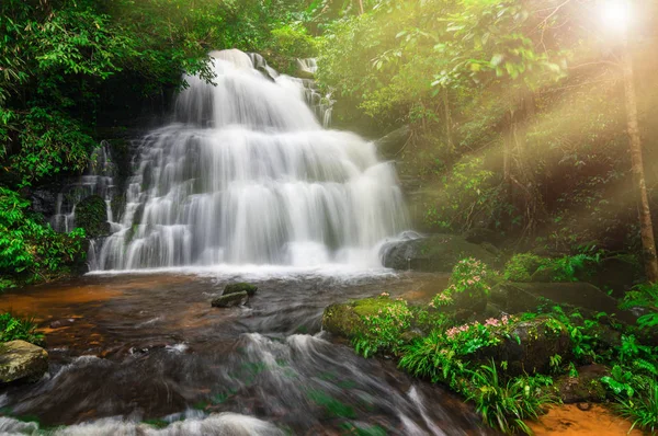 Man Daeng waterfall, Waterfall with autumn color change Beautiful nature.