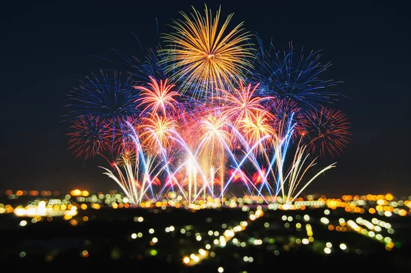 Beautiful feative firework with blur bokeh lights