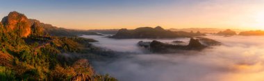 Panoramic mountain view, morning mist Viewpoint Pha Mok Baan Jabo, in Mae Hong Son province Thailand, Baan Jabo one of the most amazing mist or fog in Thailand. clipart