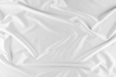 Pürüzsüz zarif beyaz ipek veya saten lüks kumaş düğün arka plan olarak kullanabilirsiniz. Lüks Noel arka plan veya yeni yıl arka plan tasarımı. beyaz kumaş dokusu. Kumaş Tekstil yüzey. üstten görünüm.