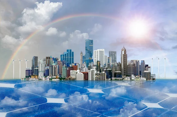 Modern city view with beautiful buildings on solar sell, rainbow on sky and the sun, Green city concept.