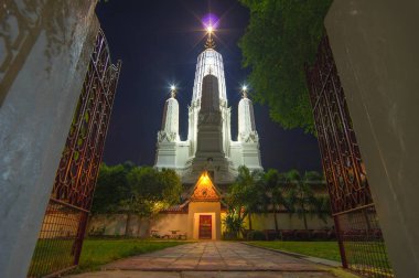 The Wat Mahathat Worawihan is a Royal temple located in an old, busy district with narrow lanes and wooden shop houses in the old center of Phetchaburi town. clipart