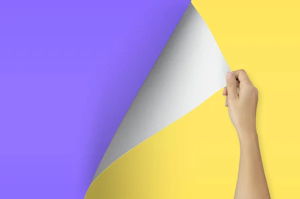 Change concept, Woman hand turning blank yellow paper page to violet paper.