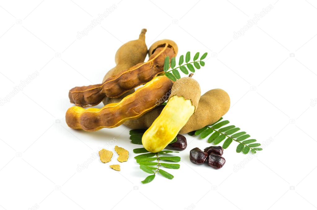 Fresh sweet tamarind isolated on  white background with leaves, seeds and bark of tamarind, Can be used as a health drink, tamarind juice.