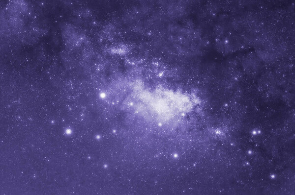 Ultra violet tone, Milky way galaxy with stars and space dust in the universe, long speed exposure, Tone purple trend.