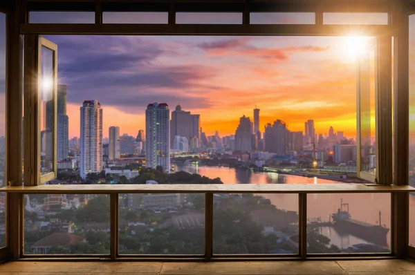 Beautiful Blank coffee shop or cafe,restaurant against blurred bangkok city view background, For montage product display or design key visual layout, at sunrise. — Stock Image Beautiful Blank Coffee Shop Cafe Restaurant Blurred Bangkok City View Stock Picture