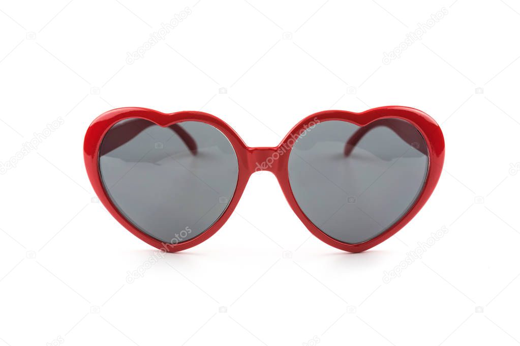 Red heart shaped sunglasses isolated on white background, summer holidays 