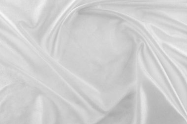 Pürüzsüz zarif beyaz ipek veya saten lüks kumaş düğün arka plan olarak kullanabilirsiniz. Lüks Noel arka plan veya yeni yıl arka plan tasarımı. beyaz kumaş dokusu. Kumaş Tekstil yüzey. üstten görünüm.