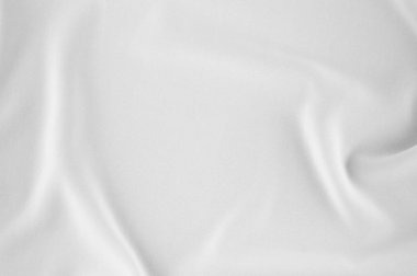 Pürüzsüz zarif beyaz ipek veya saten lüks kumaş düğün arka plan olarak kullanabilirsiniz. Lüks Noel arka plan veya yeni yıl arka plan tasarımı. beyaz kumaş dokusu. Kumaş Tekstil yüzey. üstten görünüm.