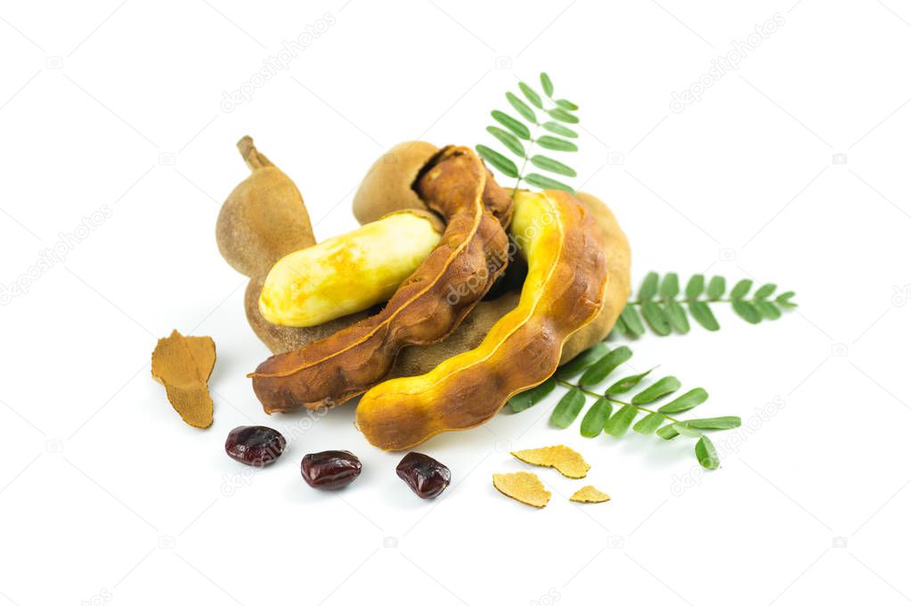 Fresh sweet tamarind isolated on white background with leaves, seeds and bark of tamarind 