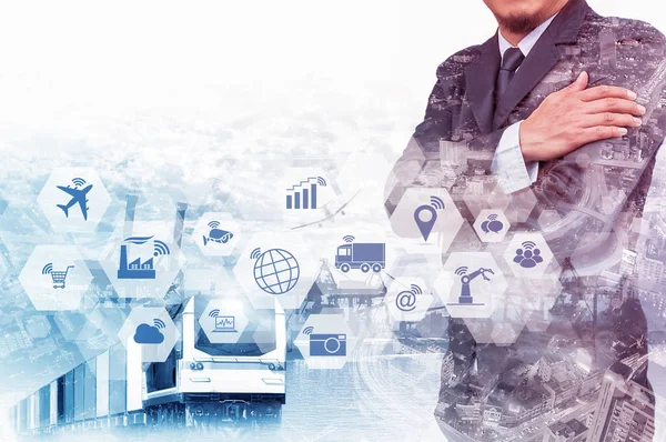 Double exposure of businessman on industrial background with Internet of things (IOT) icons and Internet networking concept, Connect global wireless devices with each other.