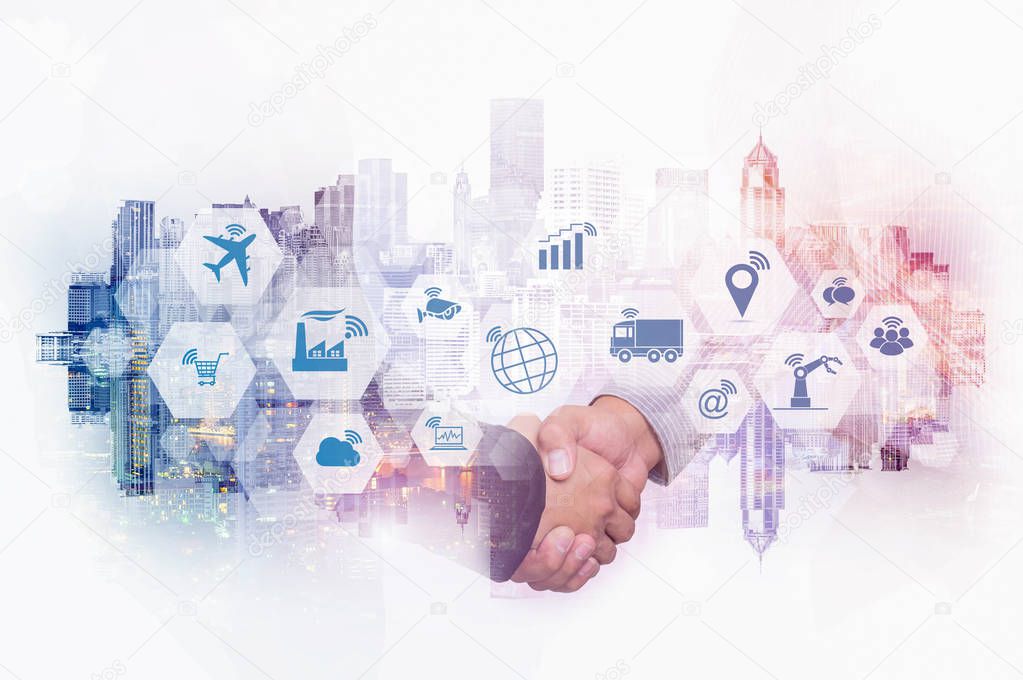 Double exposure of businessman handshake on cityscape background with Internet of things (IOT) objects icon and Internet networking concept, Connect global wireless devices with each other.