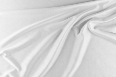 Pürüzsüz zarif beyaz ipek ya da saten lüks kumaş düğün arka plan olarak. Lüks Noel arka plan veya yeni yıl arka plan tasarımı. beyaz kumaş dokusu. Kumaş Tekstil yüzey. üstten görünüm.