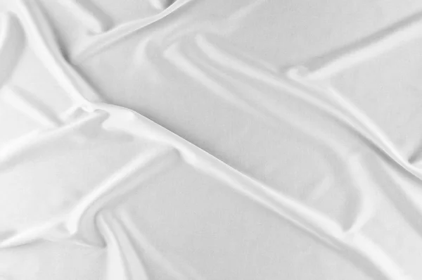 エレガントな白いシルクの滑らかなまたは結婚式の背景として高級サテン布 豪華なクリスマスの背景や正月背景デザイン 白い布のテクスチャです 布織物表面 トップ ビュー — ストック写真