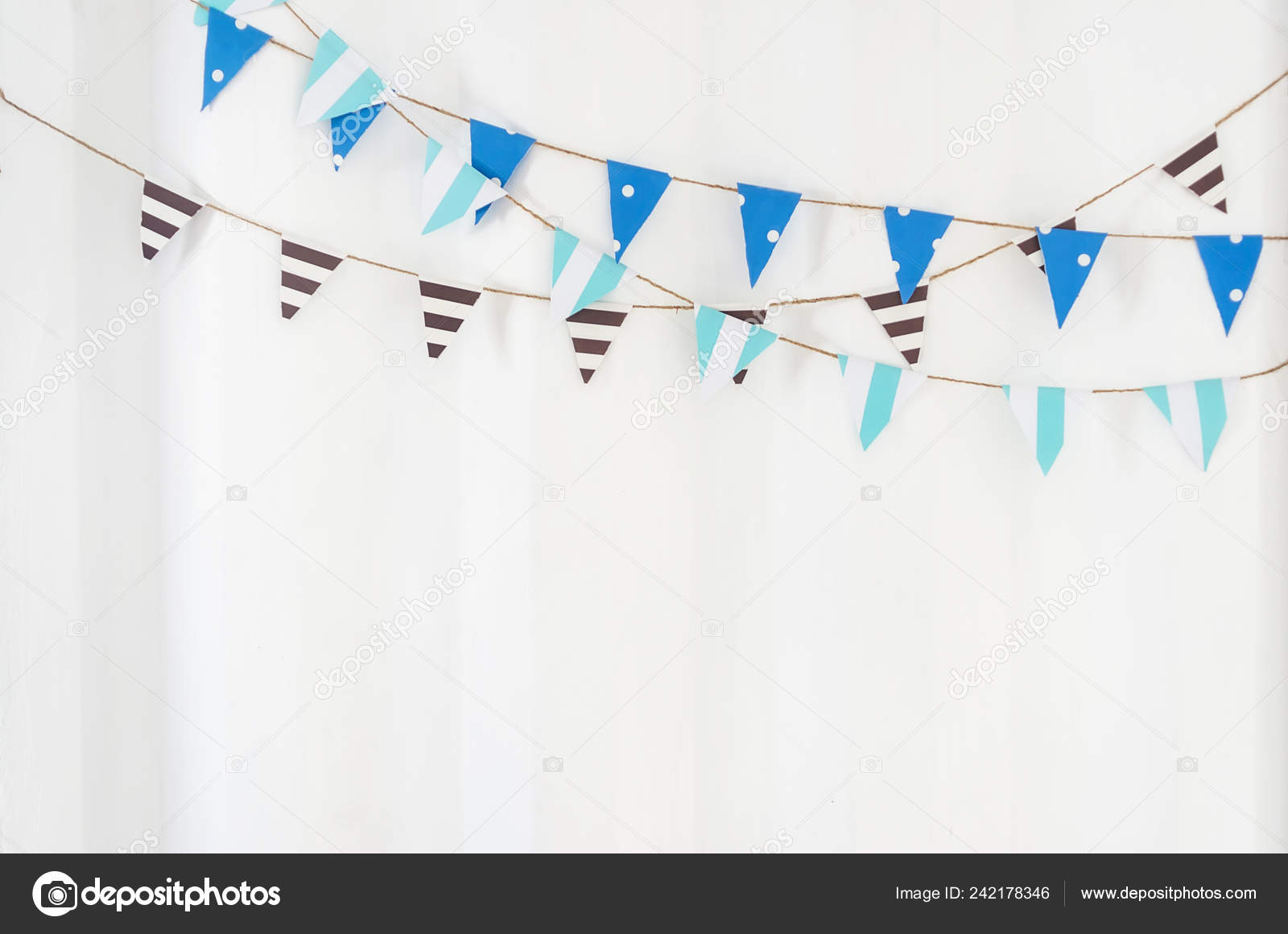 Triangle Flag Fabric Hanging Rope White Wall Stock Photo by
