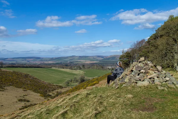 Landscape of the valley around Lauder, one person resting, in Lammermuir Hills, Scottish Border, Scotland. Uk