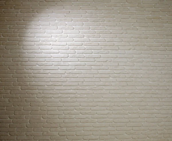 Background of white brick textured vintage wall with light