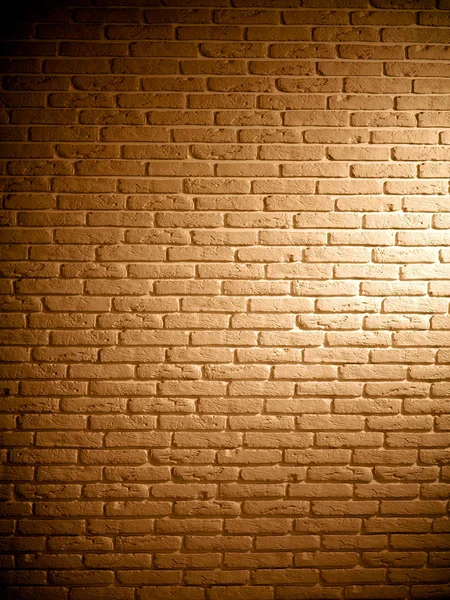 Fondo de ladrillo marrón texturizado pared vintage con luz — Foto de Stock