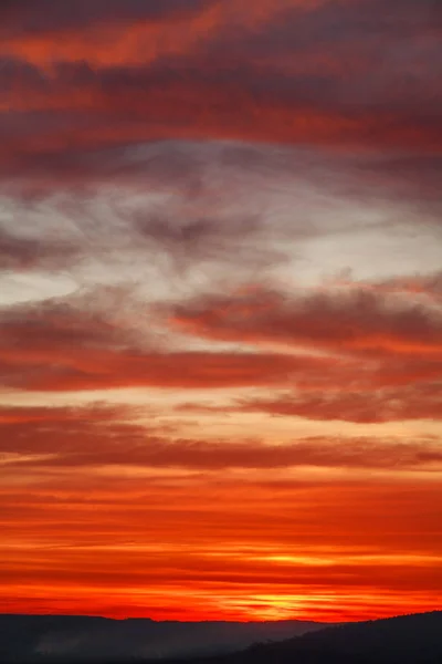 Gorgeous orange sunset colorful clouds in evening sky — Stock Photo, Image