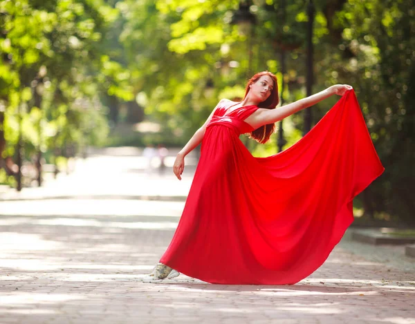 Young Woman Luxury Long Red Dress Dancing Jumping City Park — Stock Photo, Image