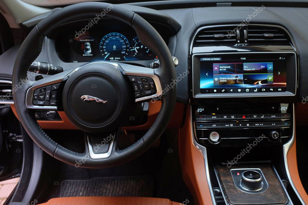 The interior of a modern Jaguar car. Beast on city streets, elegance and chic ...