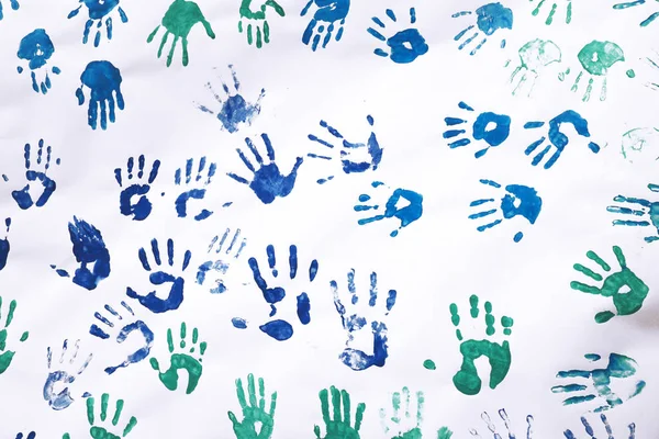 Colorful handprint symbolizes children's friendship, palm palms on a white carton, childhood memories ...