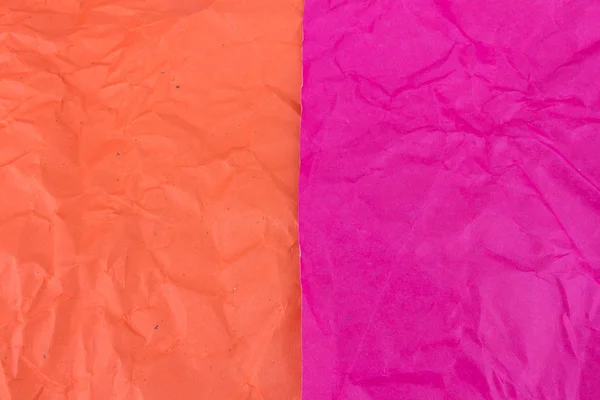 Розовый и оранжевый смятый бумажный фон — стоковое фото